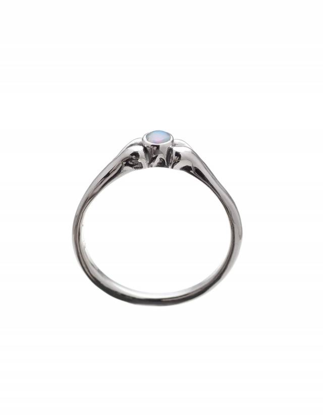 A delicate silver ring with an opal.