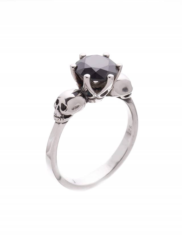 Skull ring made of sterling silver with black moissanite gemstone.