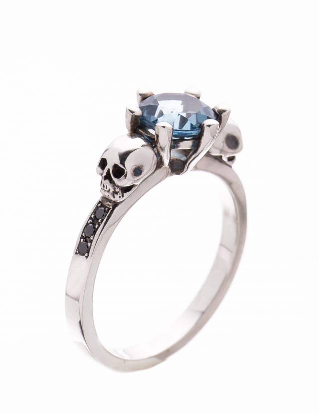 Exquisite skull engagement ring made of sterling silver with gemstones.