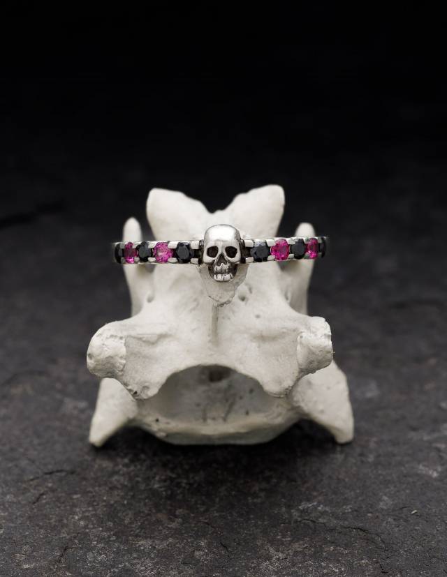 Dainty silver skull wedding ring SALACIA with pink and black gemstones.