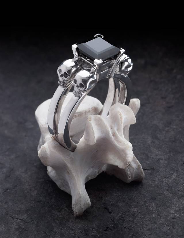 Solid silver goth ring with a black, princess cut gemstone.