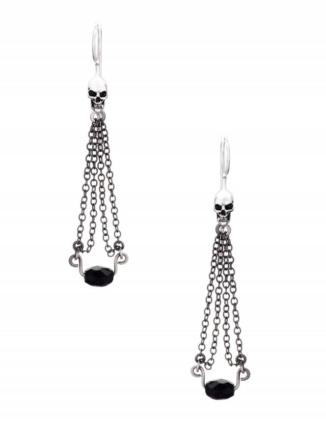 Dainty skull earrings with black gemstone, front view.