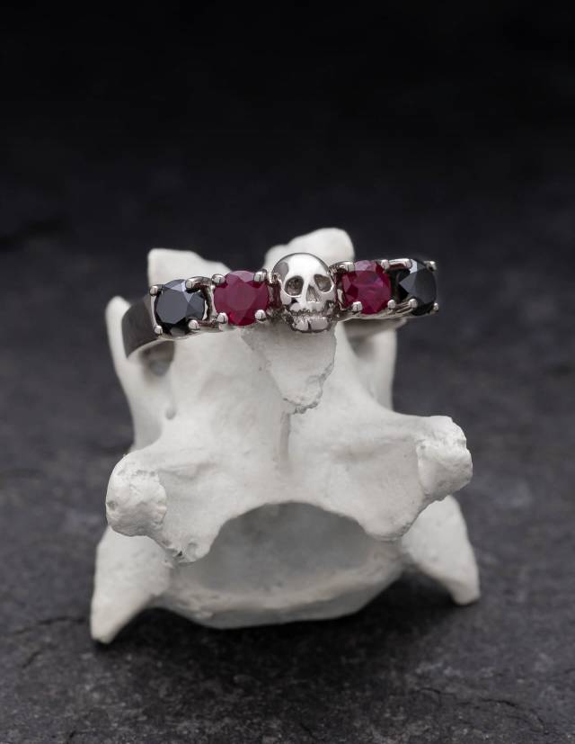 Skull wedding ring Helice made of solid 14k white gold with rubys and natural black diamonds.